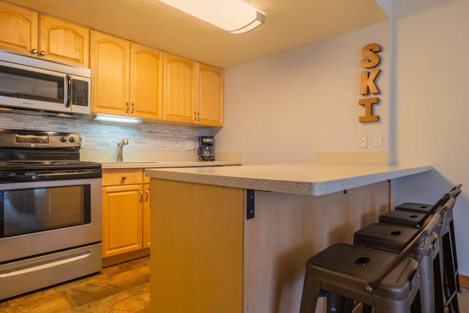 Condo, 2 Bedrooms | Private kitchen | Full-size fridge, microwave, oven, stovetop