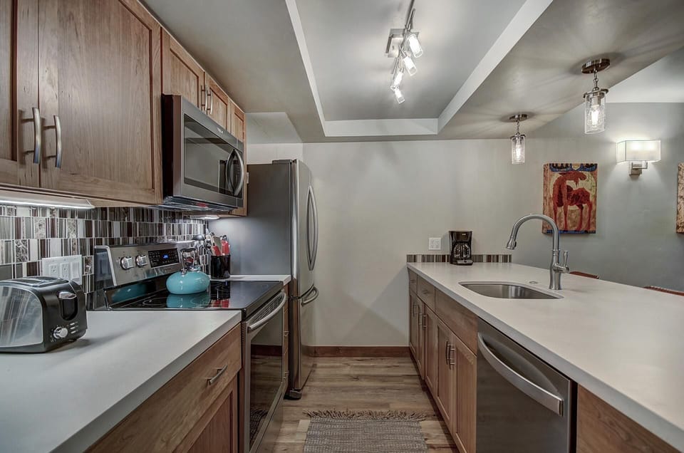 Condo, 2 Bedrooms | Private kitchen | Full-size fridge, microwave, oven, stovetop