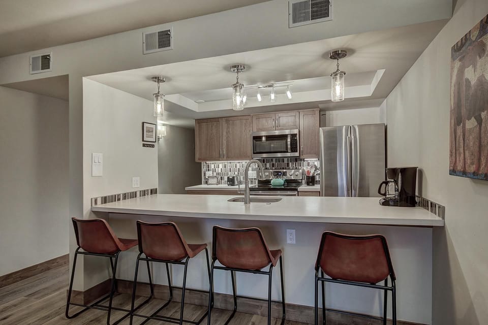 Condo, 2 Bedrooms | Private kitchen | Full-size fridge, microwave, oven, stovetop