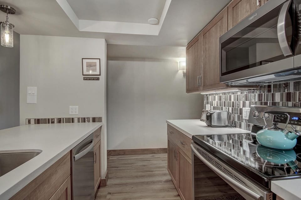 Condo, 2 Bedrooms | Private kitchen | Full-size fridge, microwave, oven, stovetop