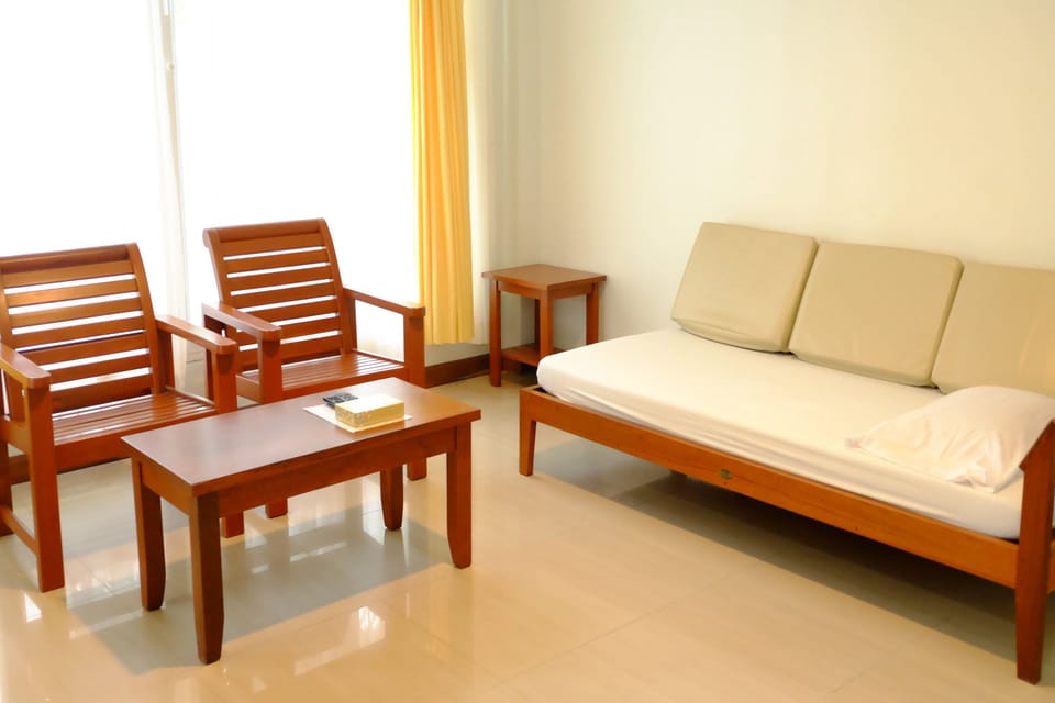 2 Bedroom Beachfront | Living area | Flat-screen TV
