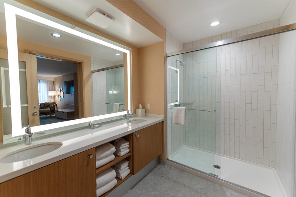 Suite, 2 Queen Beds (Signature Family, Concept) | Bathroom | Combined shower/tub, eco-friendly toiletries, hair dryer, towels