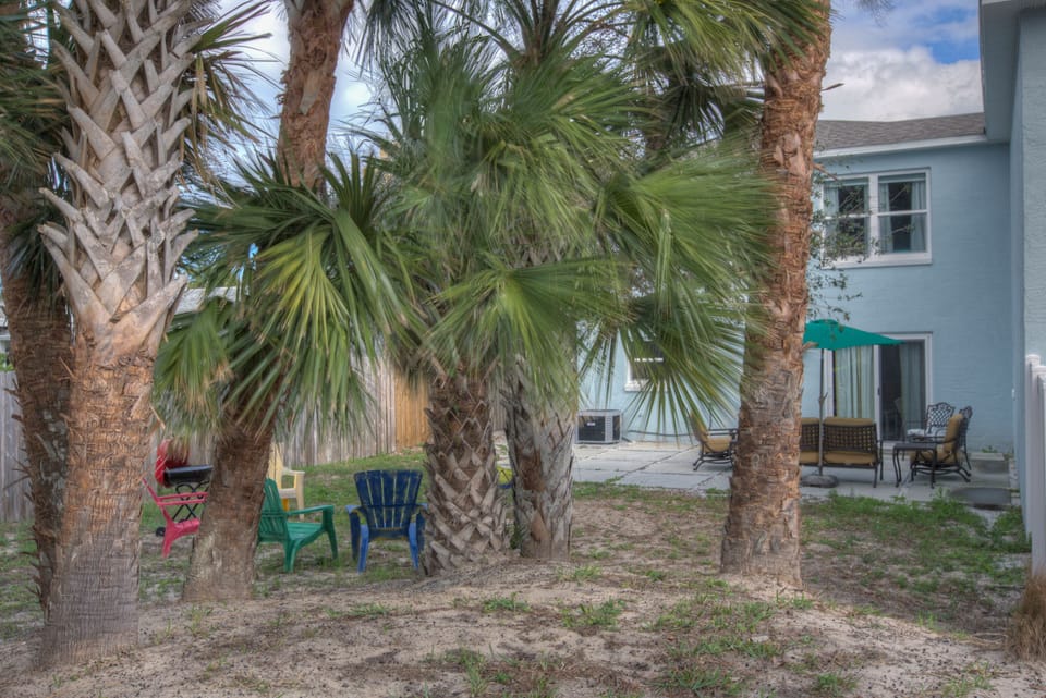 yard chairs, Grill, and hammock ready for your relaxation