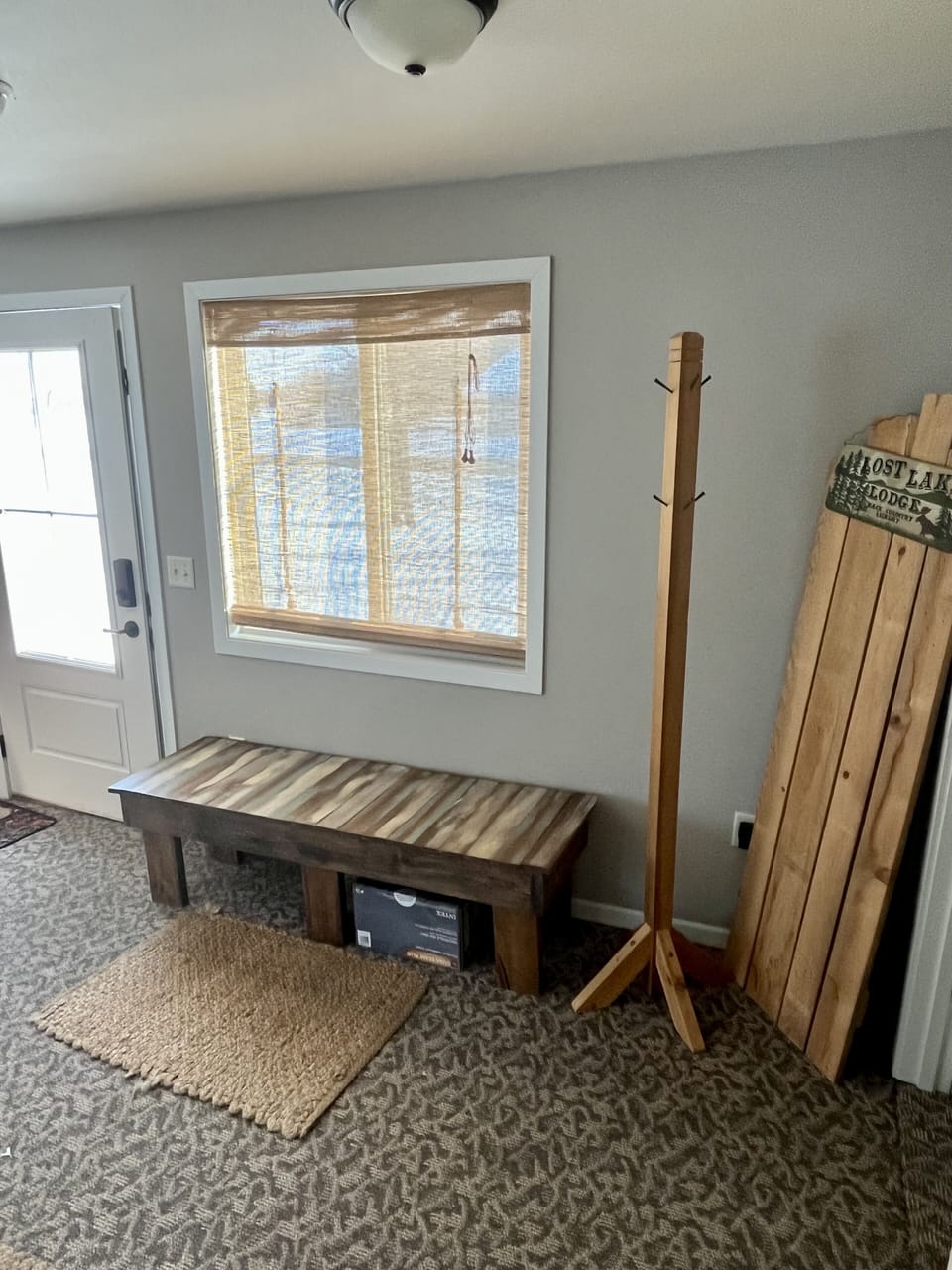 Entryway with sitting area. 