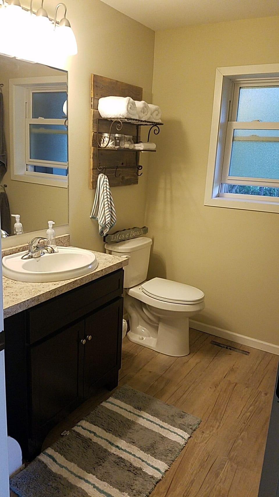 Bathroom with shower and washer and dryer. 