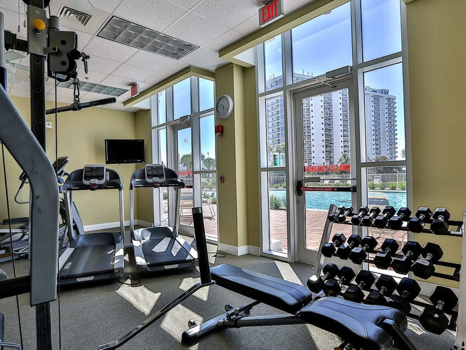 Never skip a workout at the onsite fitness center overlooking the pool area!