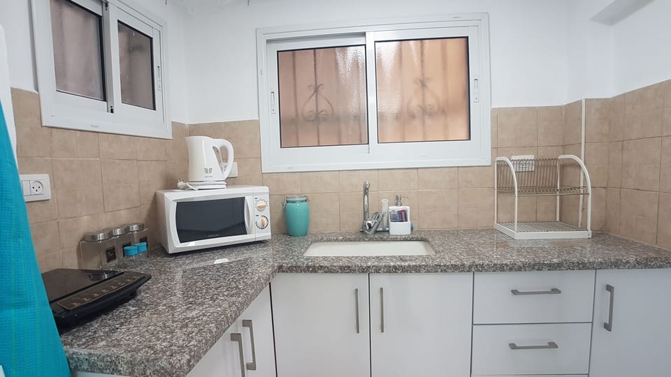 Comfort Apartment, 2 Bedrooms | Private kitchen | Coffee/tea maker, full-size fridge, microwave, stovetop