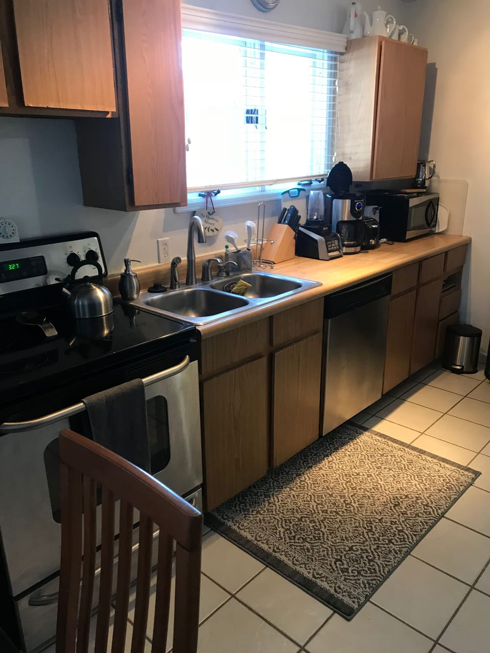 The kitchen comes fully stocked, has stainless steel appliances & a spice rack!