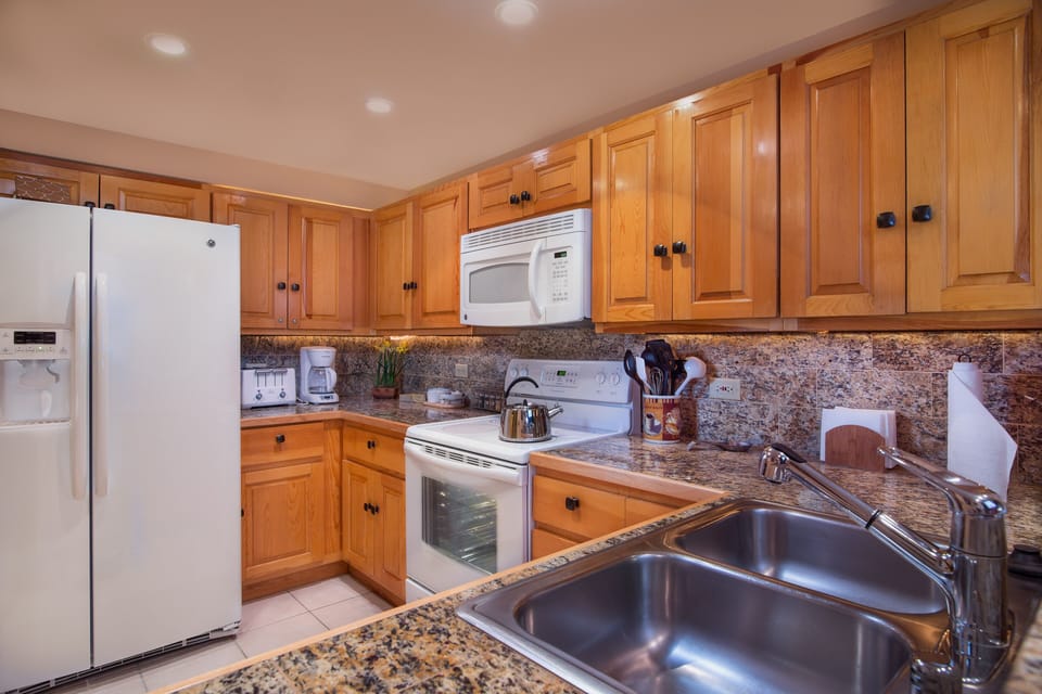 Fully equipped kitchen with new appliances and granite countertops
