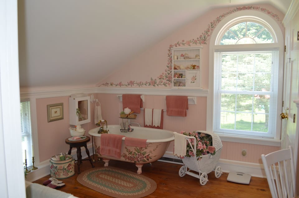 2nd floor bathroom is spacious with antique claw-footed tub.