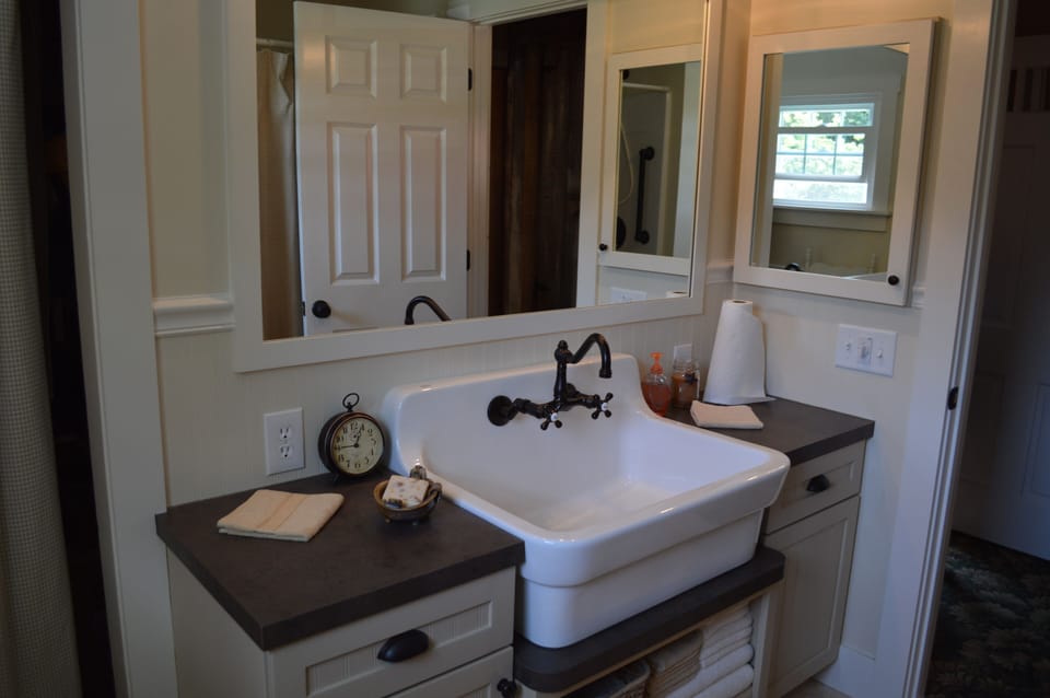 Huge farmhouse sink in the 1st floor bathroom with walk-in shower.