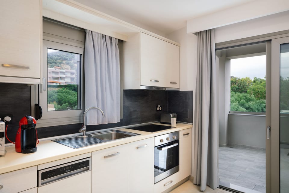 Executive Apartment, 2 Bedrooms, Sea View | Private kitchen | Full-size fridge, microwave, oven, stovetop