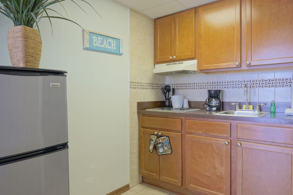 Fridge, microwave, coffee/tea maker, cookware/dishes/utensils