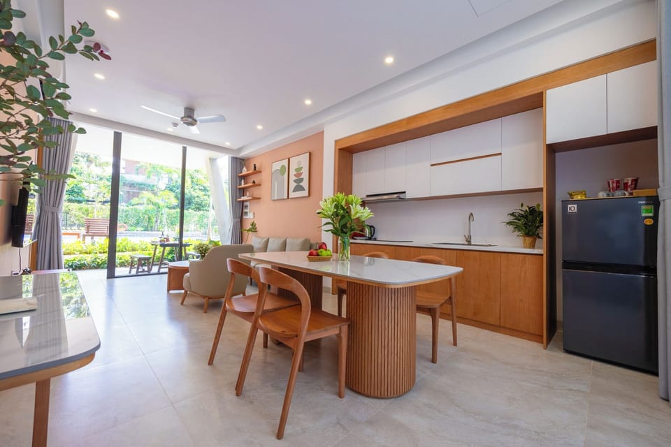 Two-Bedroom Deluxe Apartment with Garden View (Newly Built) | Living area | 70-inch LCD TV with cable channels, TV