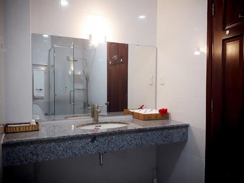 Shower, free toiletries, hair dryer, slippers