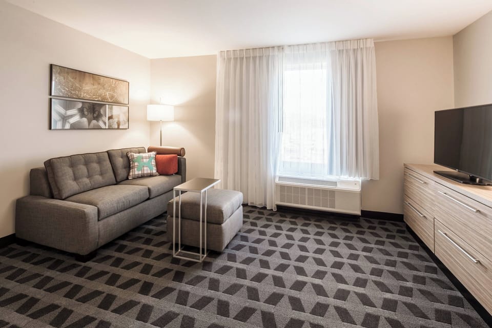 Suite, 1 Bedroom | Living room | TV
