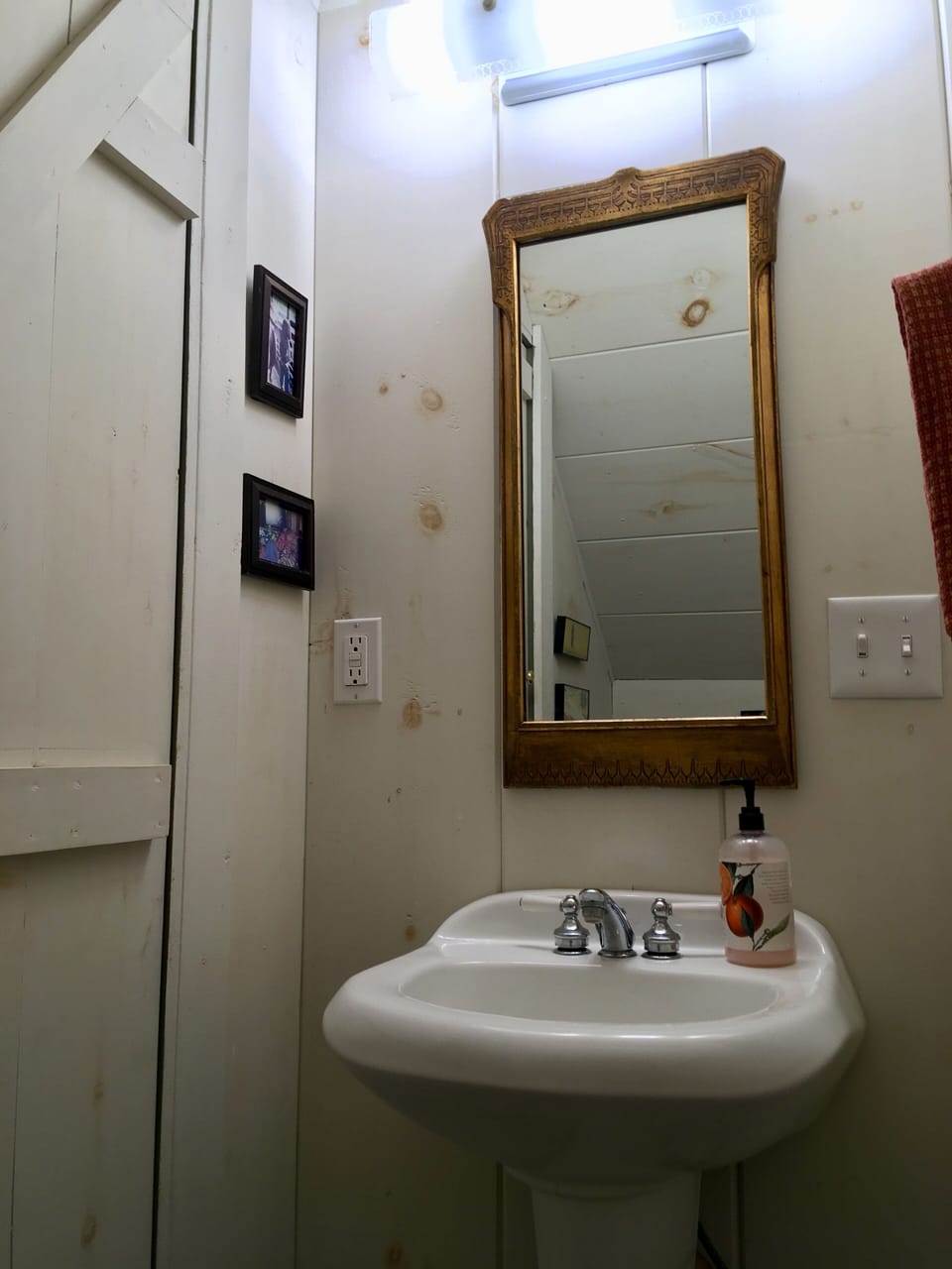 First floor guest bathroom under stairs.
