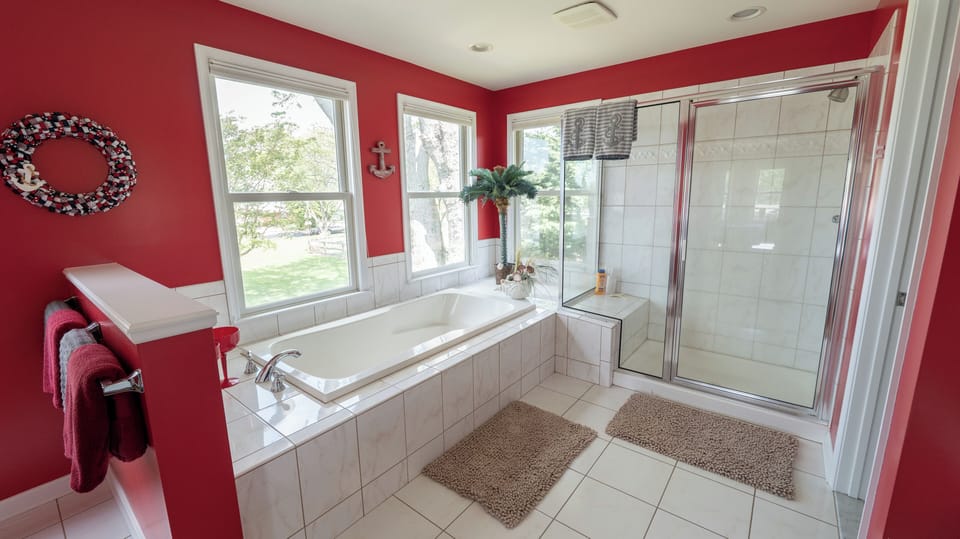 Captain's Quarters upstairs Bath. Sunken Soaking Tub. Tile Shower. Dual Sinks.