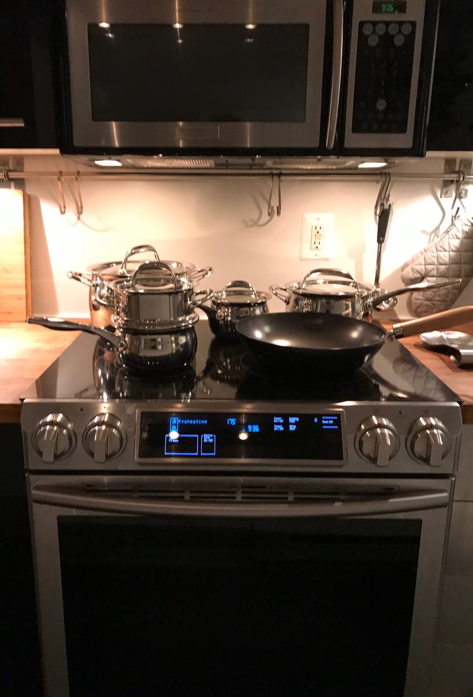 Electric range with convection oven, warming drawer and multi-function cooktop. 