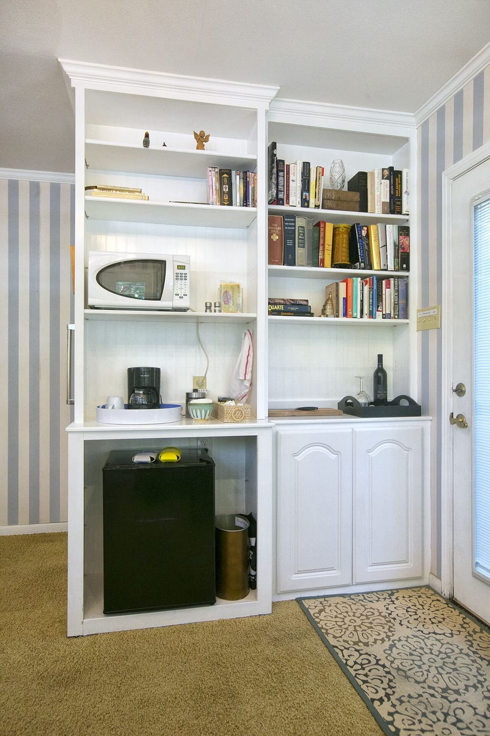 The suite is outfitted with a microwave, mini-refrigerator and coffee maker, wine & beer & water! 