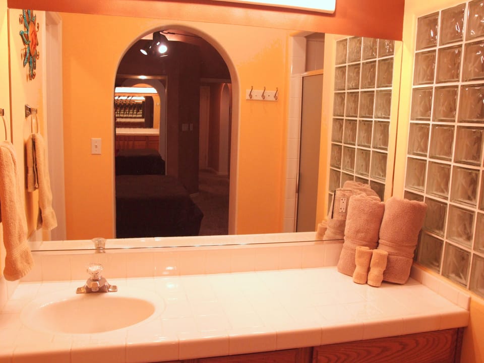 The Master bedroom has a bathroom with single sink large counter vanity.