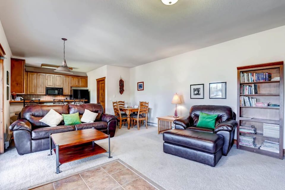 View of living room and kitchen from the entrance door.