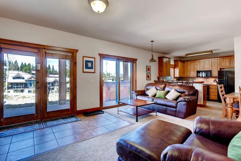 Well lit living area with a view to the private hut tub.