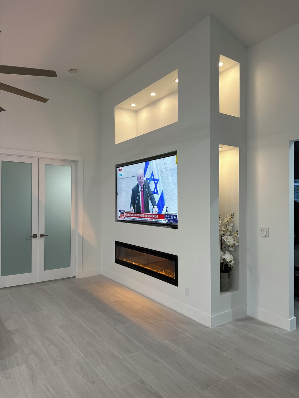 Tv Room 85 inch Tv and Fire Place