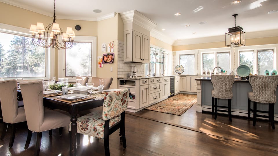 Kitchen dining and large bar leads to expansive treks deck.