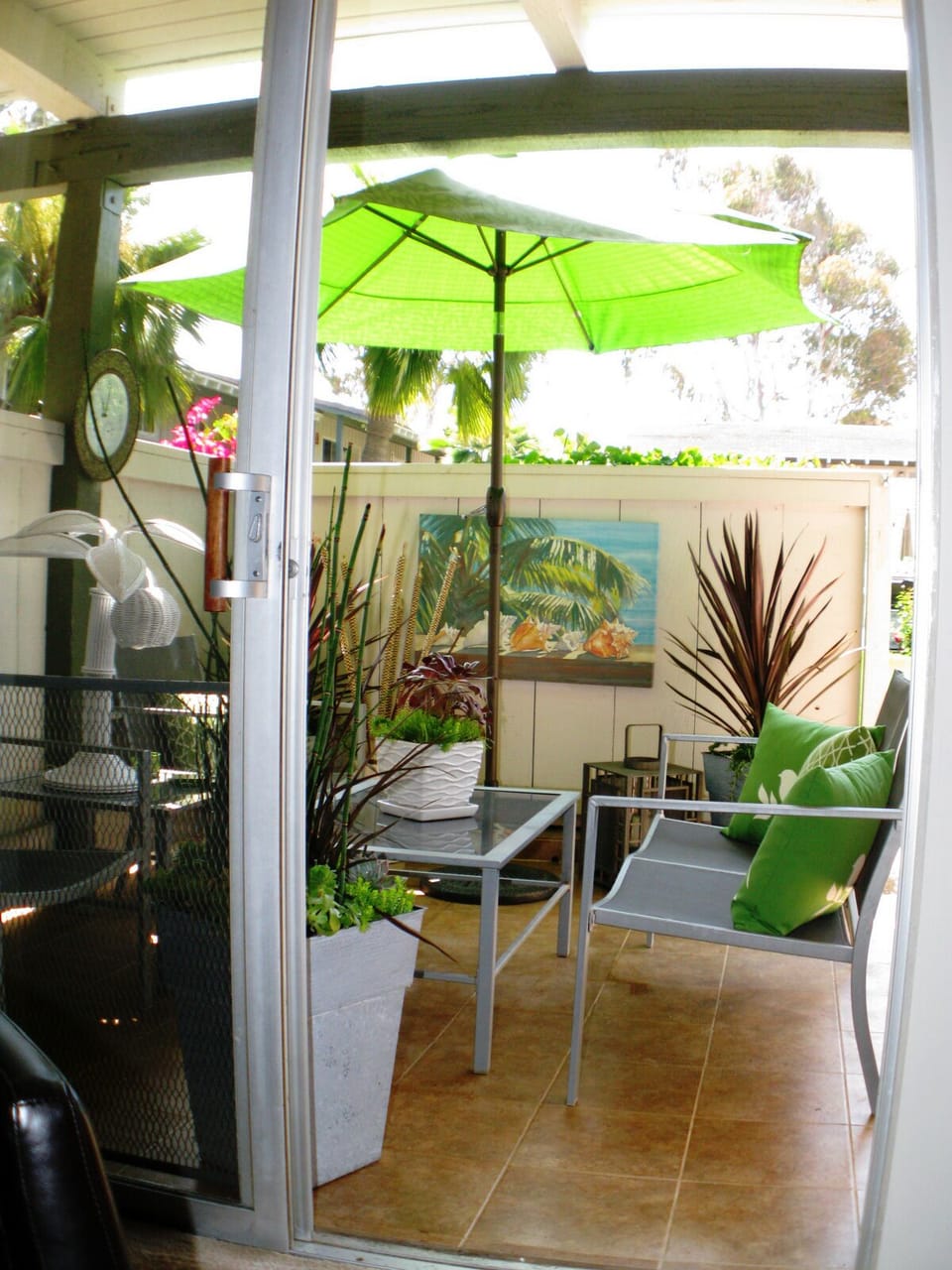 Relax on your own private front patio after a nice day at the beach.