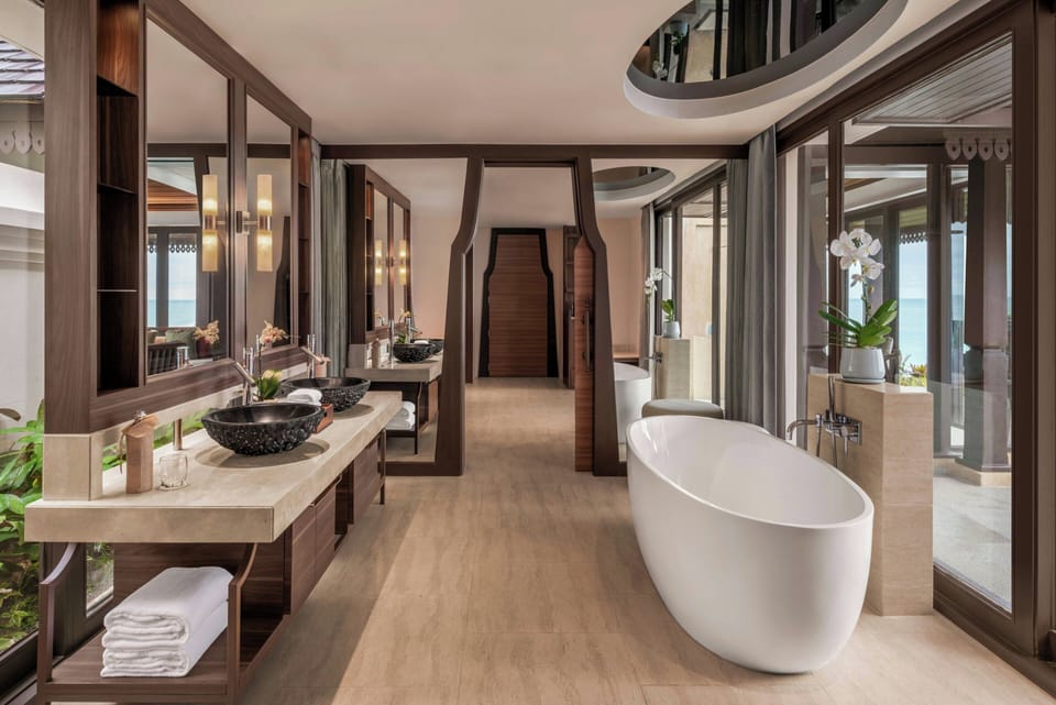 Separate tub and shower, designer toiletries, hair dryer, bathrobes