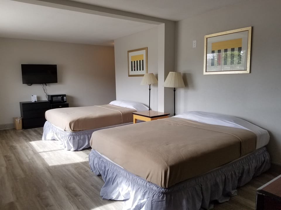 Economy Double Room, 2 Queen Beds | Individually decorated, individually furnished, desk, free WiFi