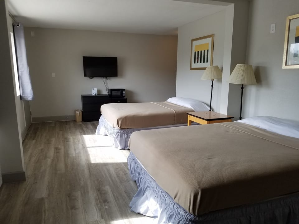 Economy Double Room, 2 Queen Beds | Individually decorated, individually furnished, desk, free WiFi