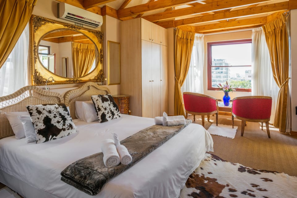 Bay Window Studio Apartment with balcony | Premium bedding, in-room safe, individually decorated