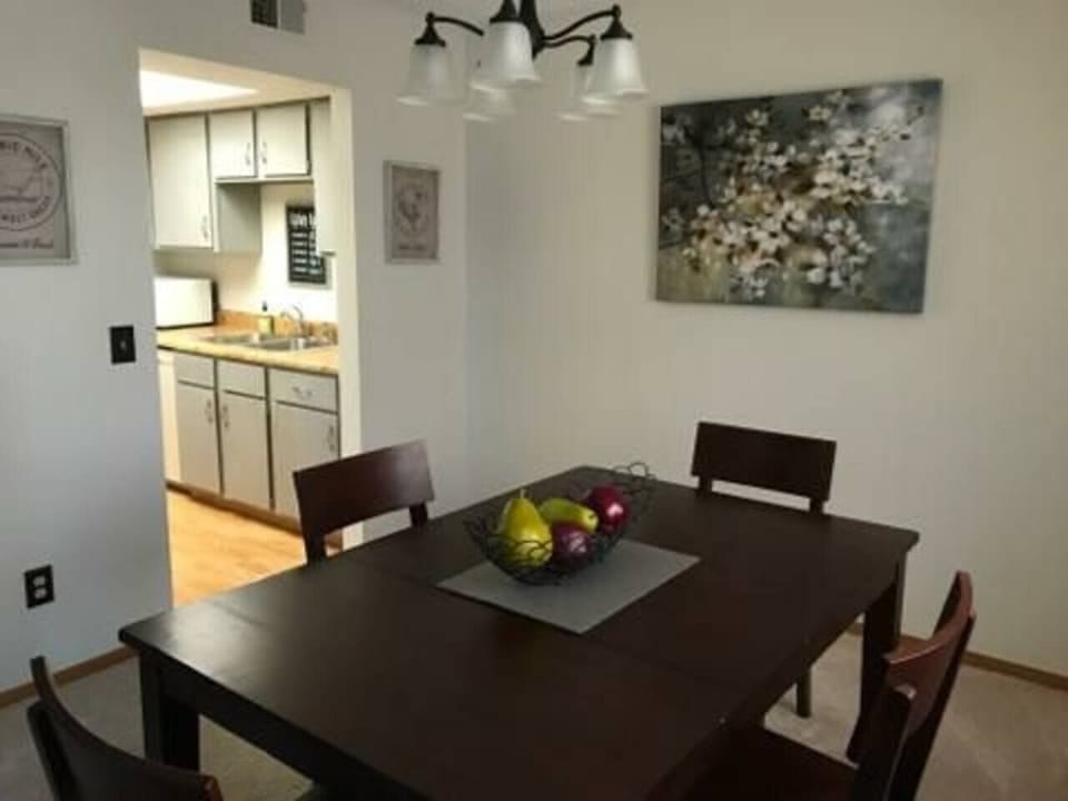 Dining Room with four chairs and place settings
