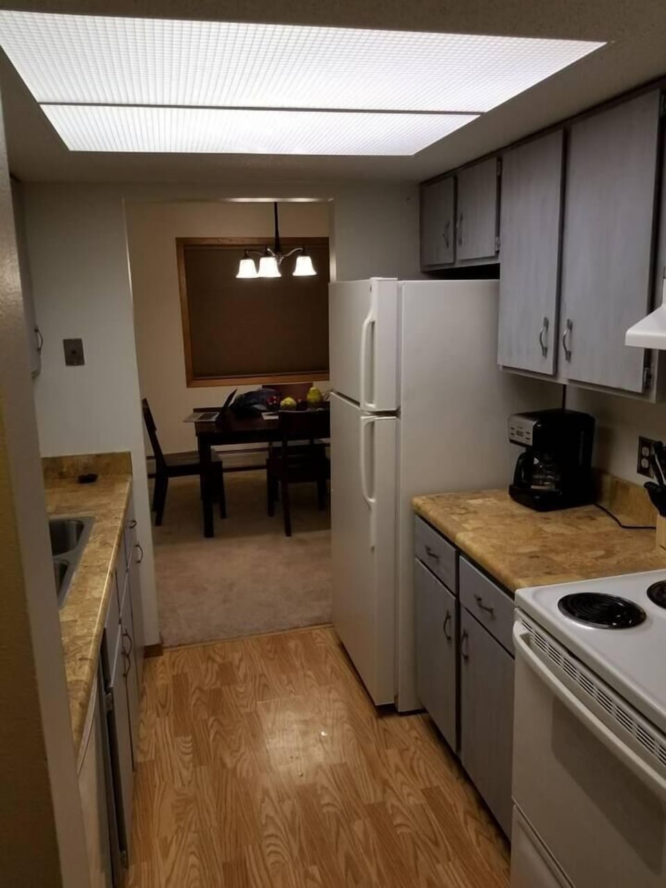 Kitchen w/appliances, cook/bakeware, place settings, microwave, and coffee machine