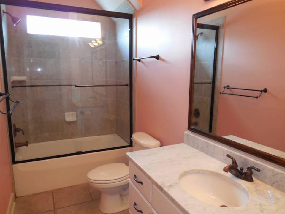 This bathroom is shared by two of the bedrooms on the first floor that are direc