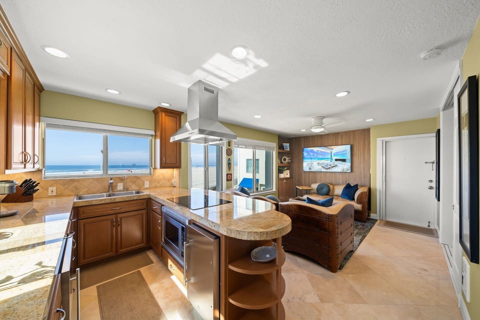 Beachfront kitchen, living area with 55" smart tv, cable, Wi-Fi with VoIP phone.