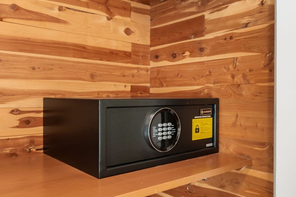 Personal safe secured inside cedar lined closet.
