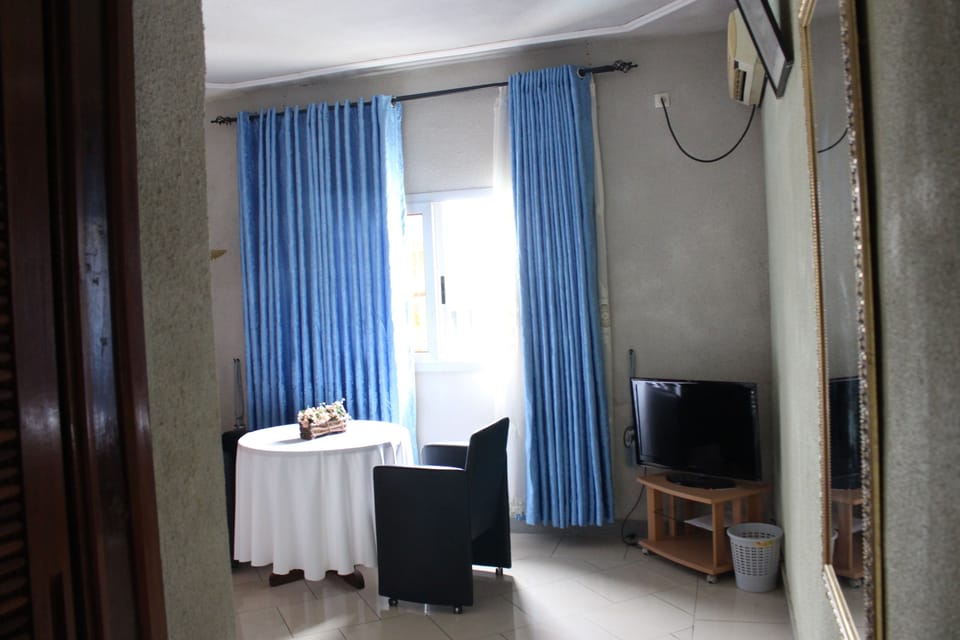 Deluxe Double Room | Living room | Flat-screen TV