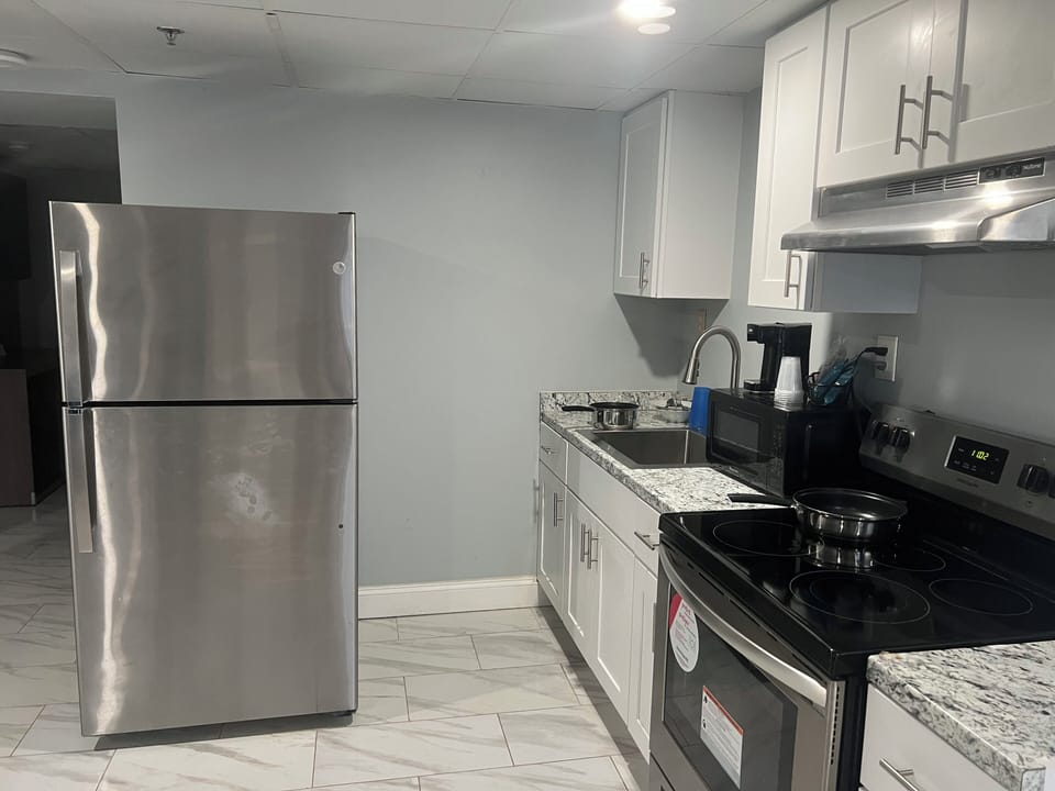 Superior Room, 1 King Bed (Kitchen, Smoke Free) | Desk, laptop workspace, blackout drapes, iron/ironing board
