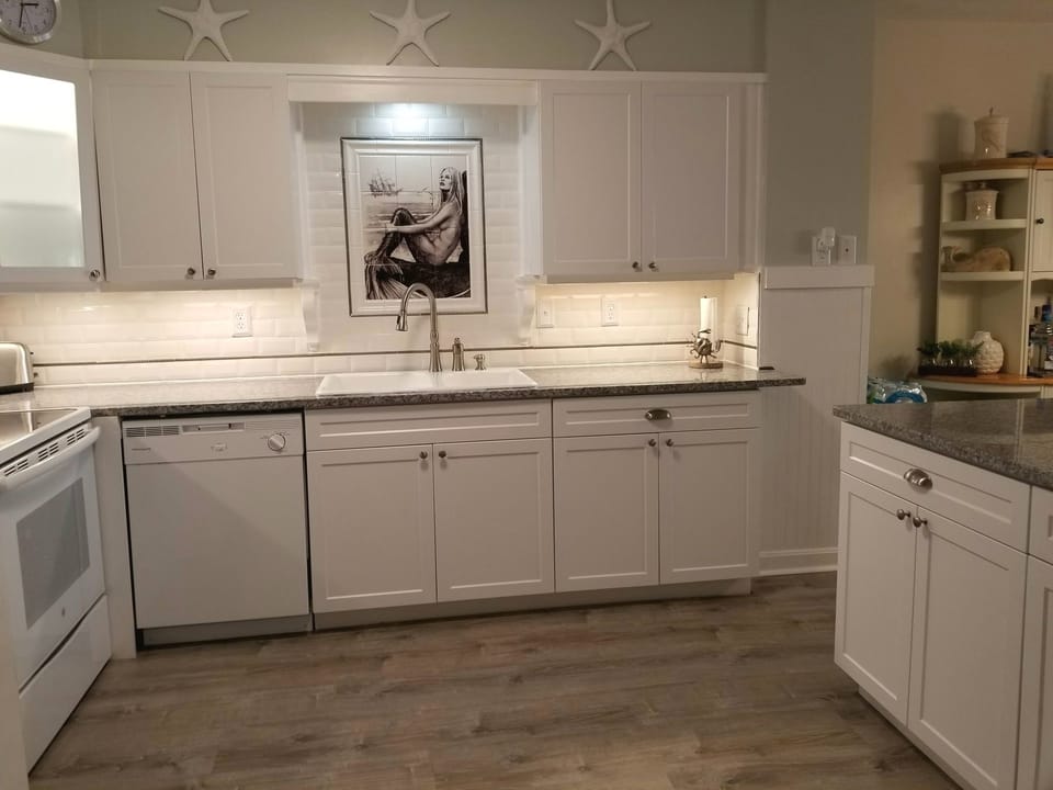 Granite Countertops, tiled backsplash, Dishwasher
