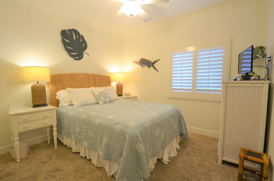 Second bedroom has a queen bed and high definition TV.