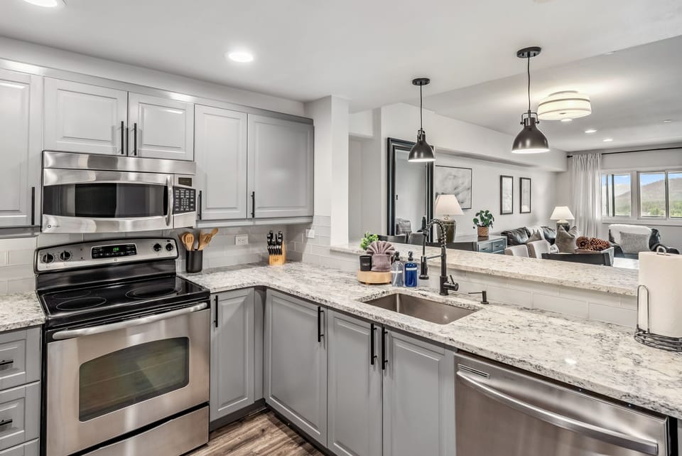 Modern kitchen magic: quartz counters, Keurig coffee bar, and sleek style