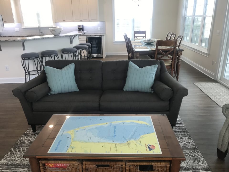 Queen sleeper sofa, coffee table w/ games & DVD's. More games in bedroom closet.