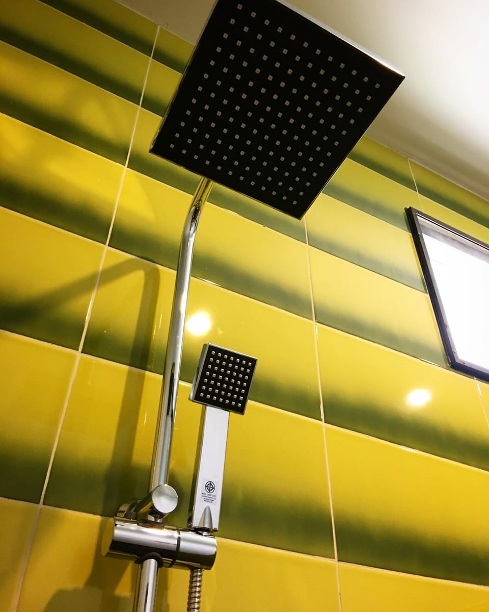 Family Room 1 | Bathroom | Shower, rainfall showerhead, free toiletries, hair dryer