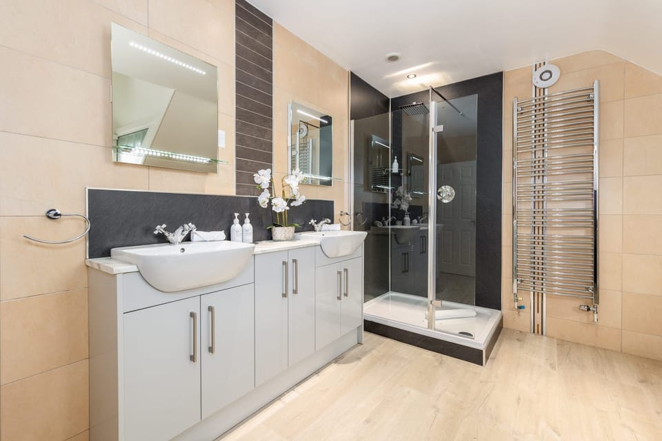 Master Room | Bathroom | Designer toiletries, hair dryer, bathrobes, slippers