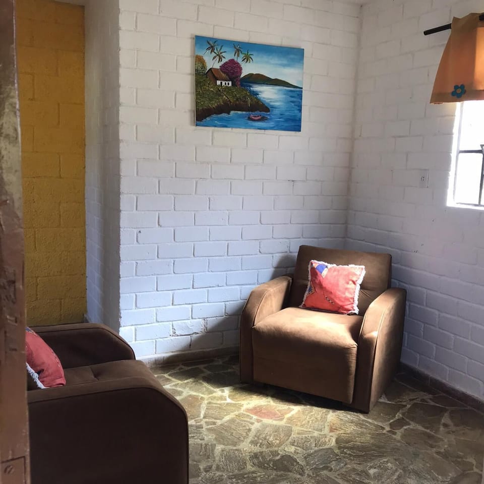 Standard Suite, 1 Bedroom, Lagoon View | Living room | 20-inch TV with satellite channels