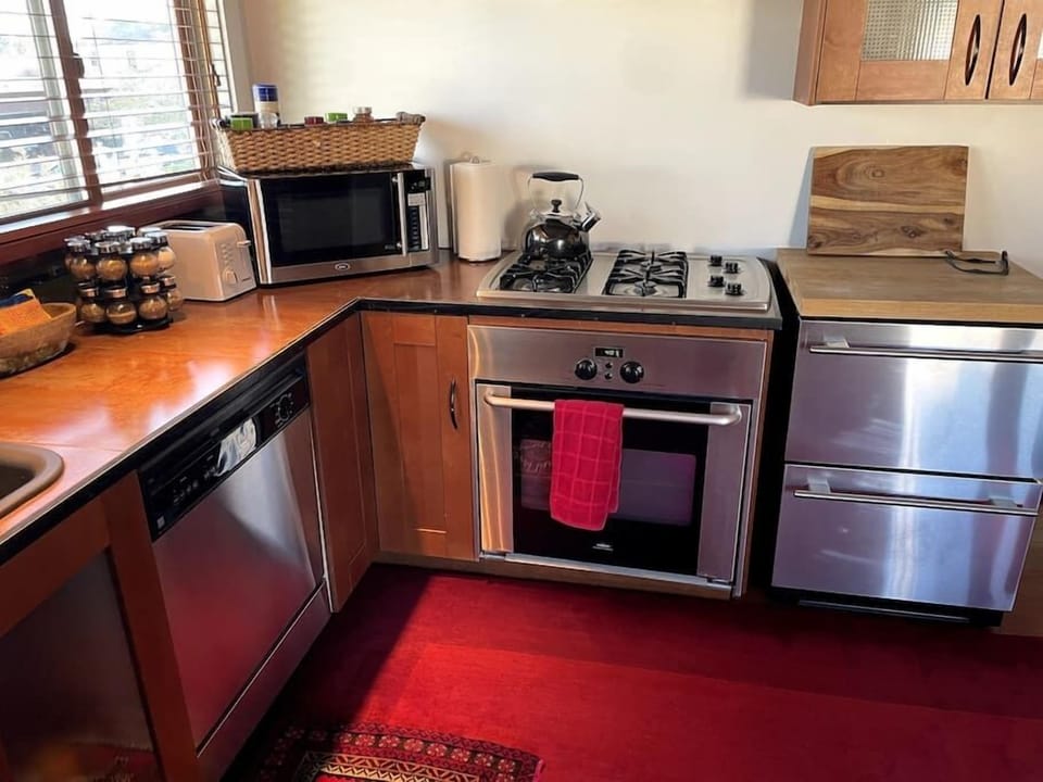 Efficient kitchen comes at a price. The fridge is a double drawer unit and the Freezer is on the deck though:).