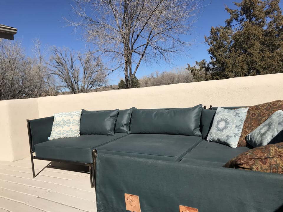 Spacious terrace with comfortable outdoor seating and mountain views.